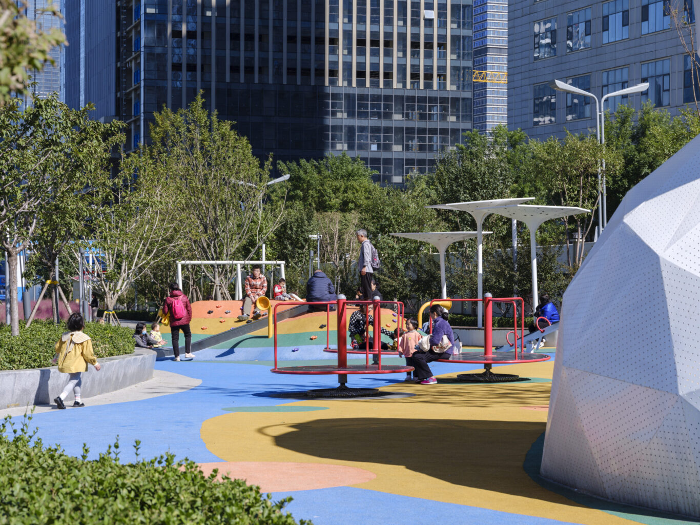 Slide 4 of 4, Children play in playground in Jinan RIbbon Park