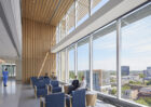 Interior view of double-height patient care community lounges.