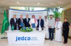 Photograph of ceremonial contract signing attendees in Jeddah for T3A West Terminal at King Abdulaziz International Airport in Jeddah