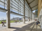 Beneath the arcade of the Science and Engineering Building, designed by EHDD, with Kolligian Library seen across the quad. Photo © Cesar Rubio