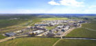 Wide-angle aerial view of the U.C. Merced campus showing the surrounding fields of the San Joaquin Valley.