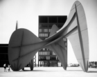 A Calder sculpture on a public plaza in front of an office building
