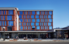 A street level view of the Taylor Street Apartments and Little Italy Branch Library