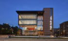 Glass and brick building at dusk.